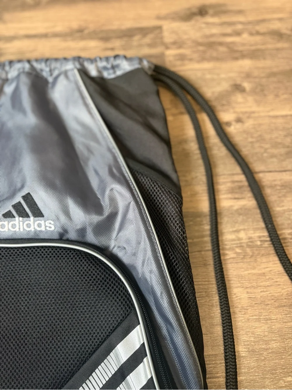 adidas Black and Silver Drawstring Backpack with Front Zip Pocket